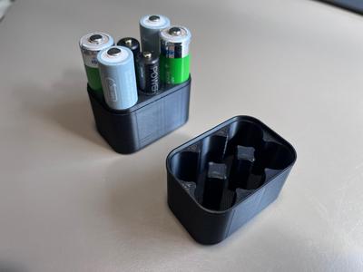 Battery holder for AA and AAA batteries