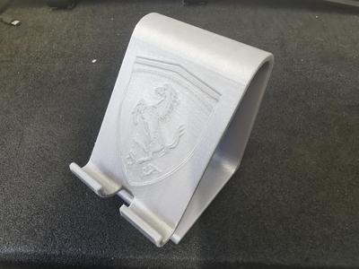 Smartphone holder with Ferrari logo