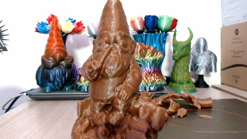 Gnome chillin on a log smokin a pipe