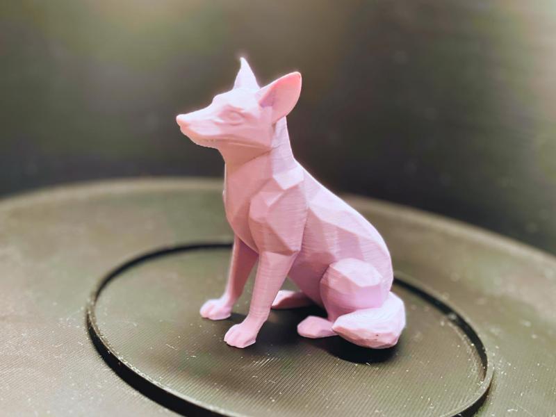 Low-poly style seated fox figurine