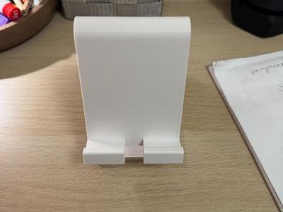 A simple phone stand with charger cutout