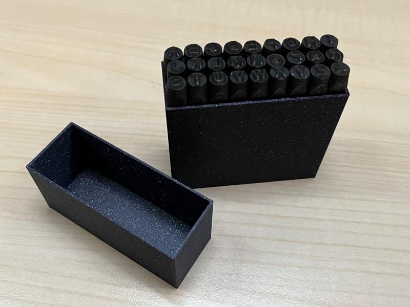 Storage box for metal embossing stamps