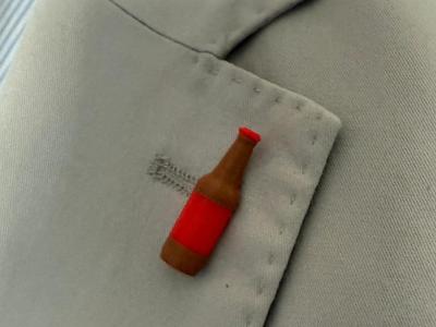 Bottle with lapel pin