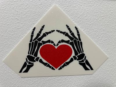 skeleton hands with heart