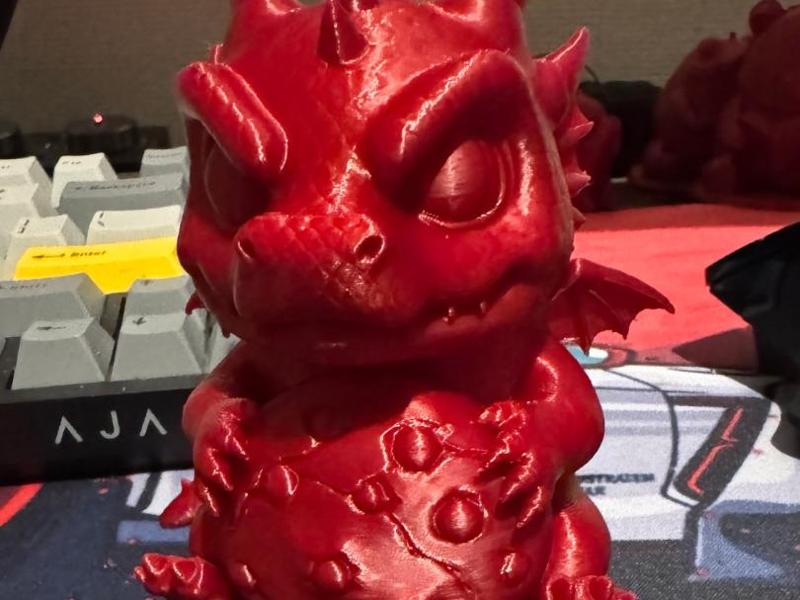 Cute dragon holding his fortune cookie