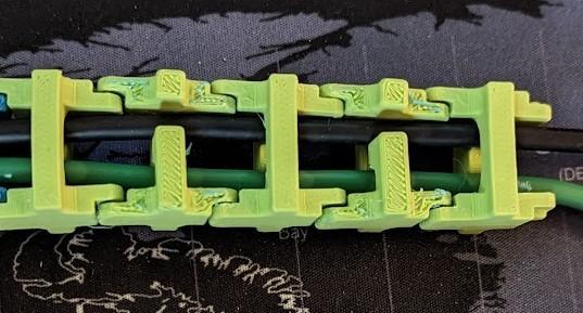 Desk cable guide/cable spine