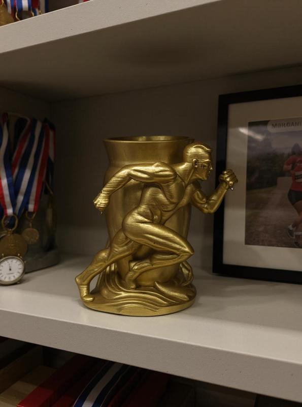 Victory in Motion – Golden Runner Vase for Champions
