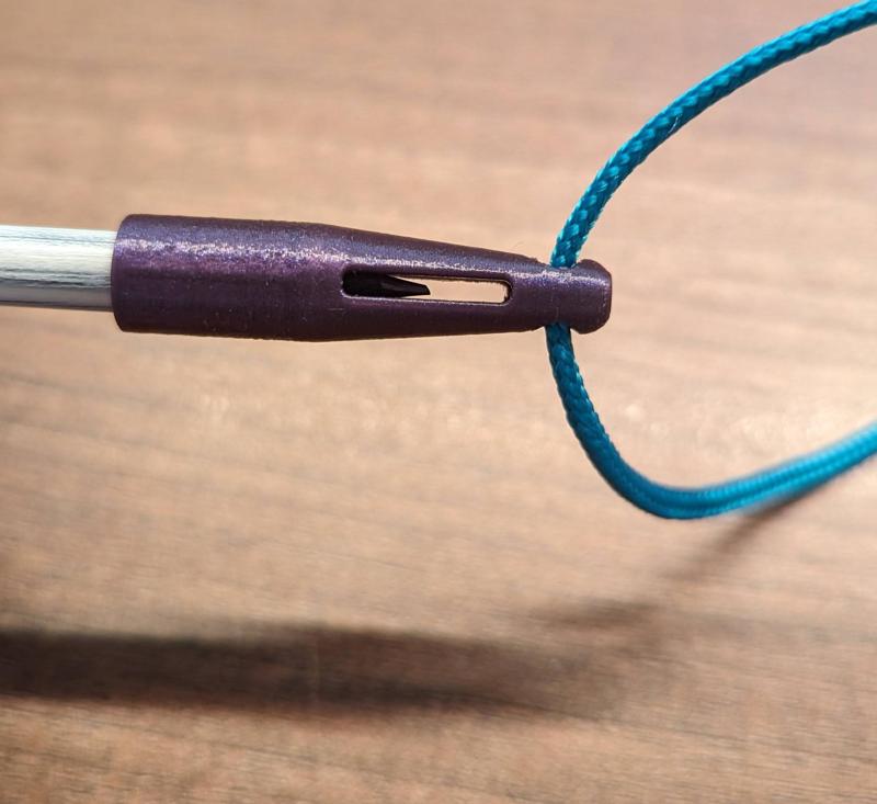 Pencil cap with lanyard eyelet