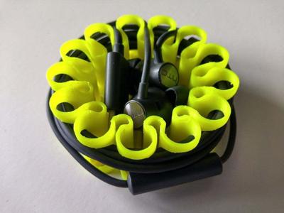 Earbud spool with cable fixing feature