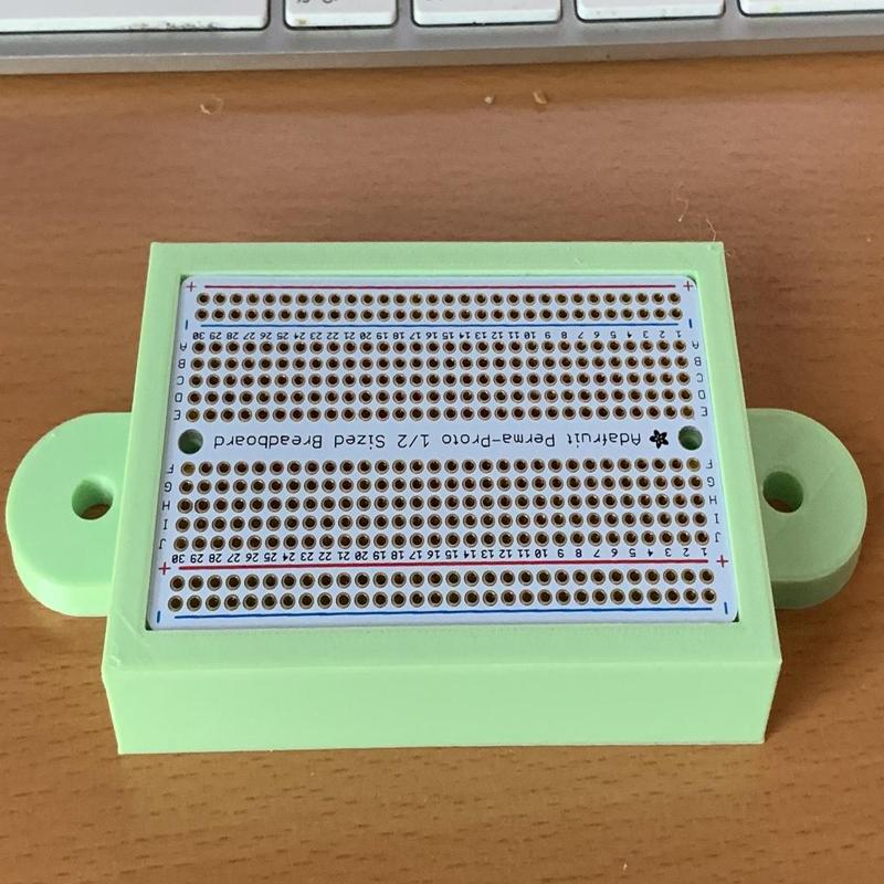 Mount for a half size Perma Proto Board on an 8020 Series 10 extrusion