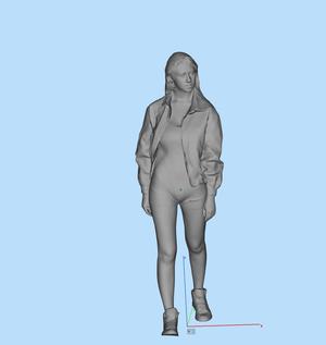 Miniature figure model female walking looking side long hair