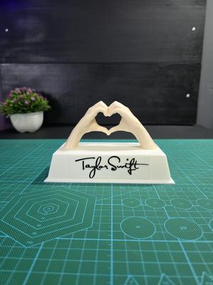 Taylor Swift base with two hands forming a heart
