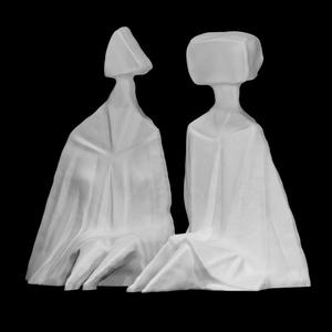 Pair of Sitting Figures I