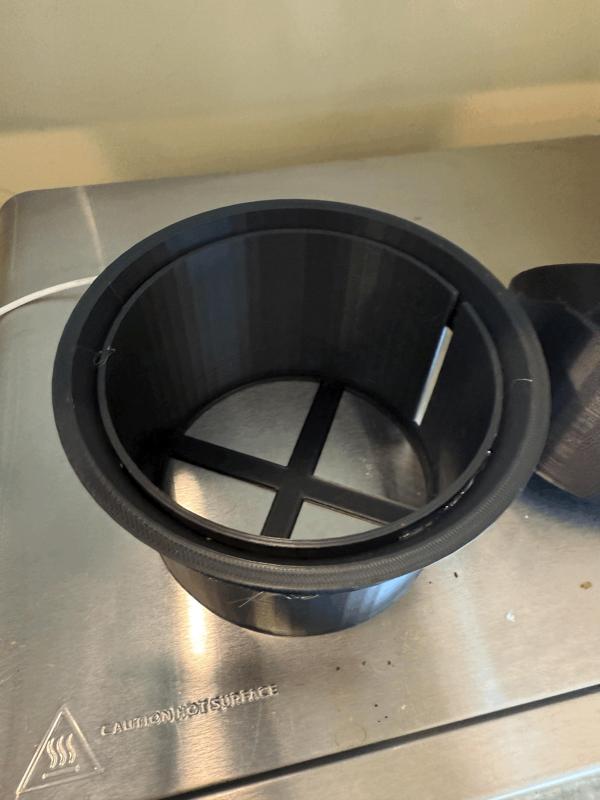 Slow coffee bean feeder for a burr grinder   