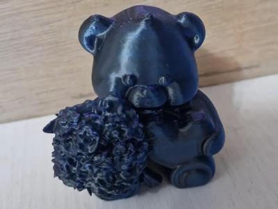 bear with a bouquet of flowers