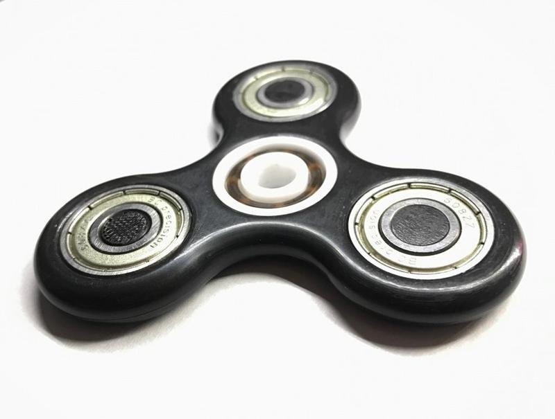 Fidget spinner with epoxy shield