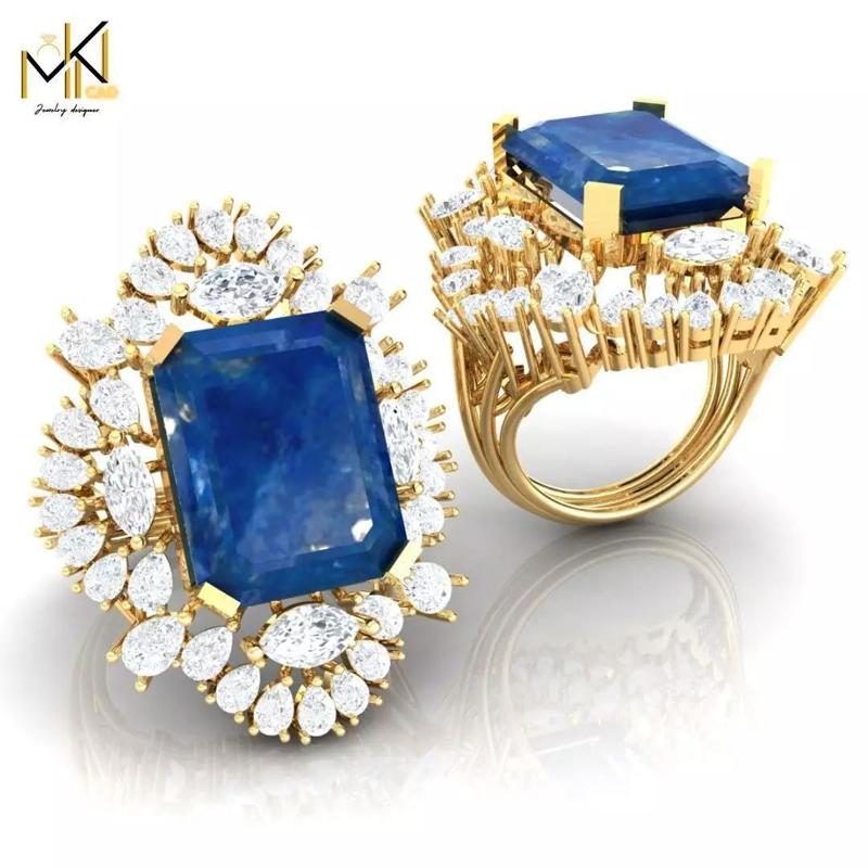 RING with deep blue color stone embraced by diamonds
