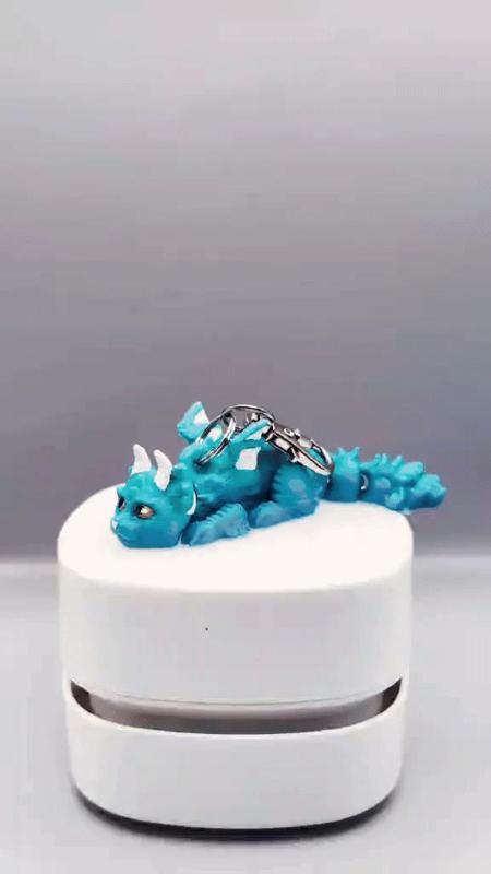 scruffy baby cat dragon keychain