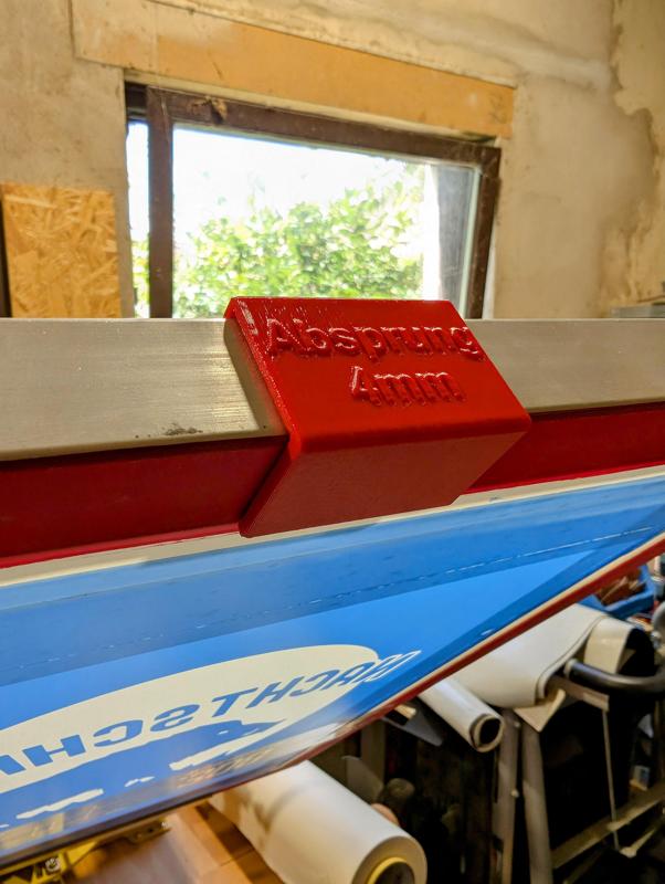 Siebdruckrahmenklemme für Absprung