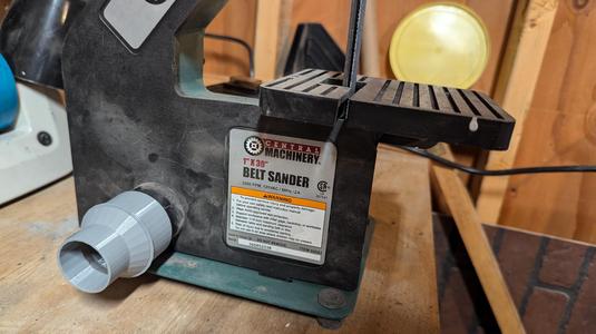 Harbor Freight 1"x30" belt sander shop vac adapter.