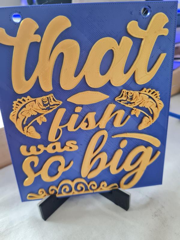 "Big Fish Story Plaque - Witty Motto with Leaping Bass Silhouette"