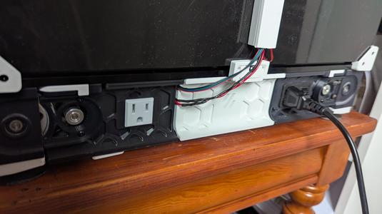 Electric outlet keystone skirt panel