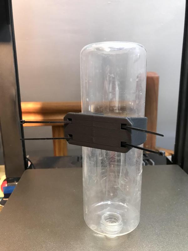 Pet drinking water bottle holder