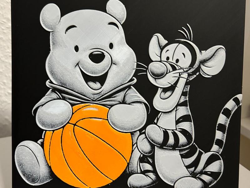 Winnie the pooh and Tigger playing with a ball