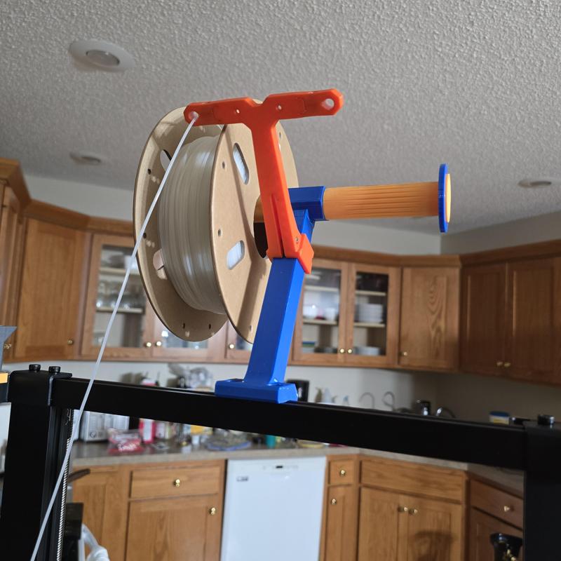 Filament guide for top mount filament holder
