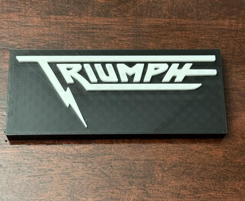 Triumph Band Sign
