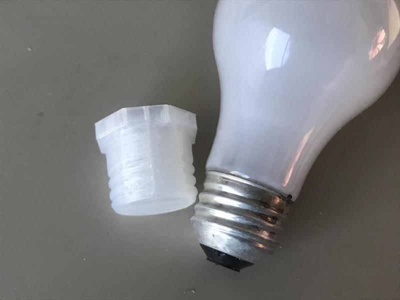 Screw-in lightbulb socket filler blank for E26/medium base