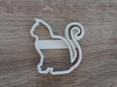 Silhouette of a cat that cuts up biscuits