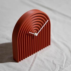 Curly standing clock