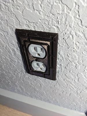"Modern" design outlet cover.