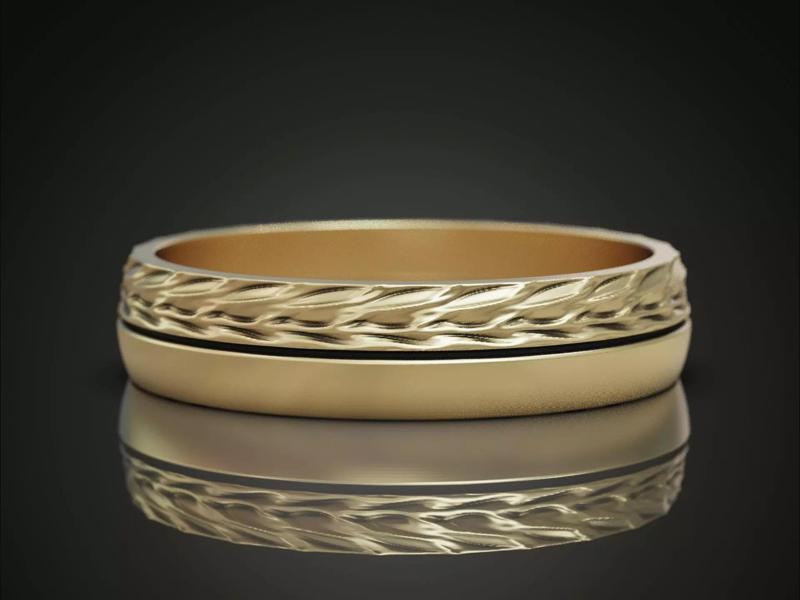 Ornamental ring with woven pattern and textured surface