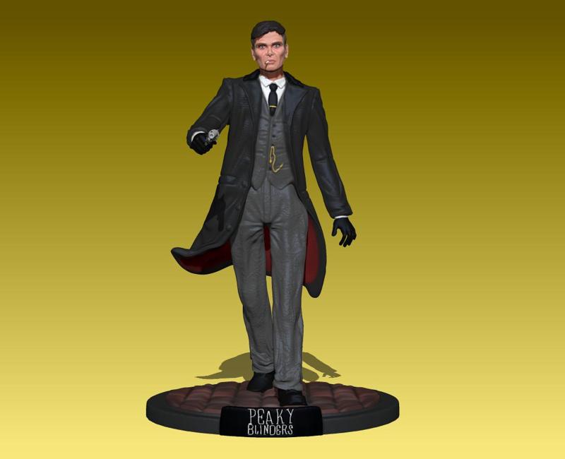 thomas shelby cillian murphy from the peaky blinders walking with gun pose