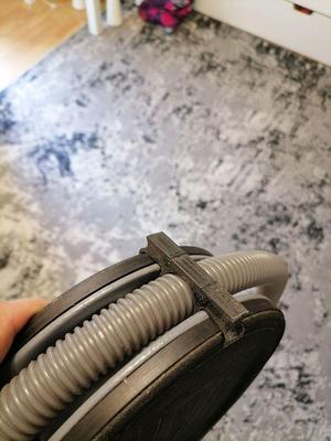 Boat foot pump hose clamp