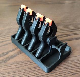 Plastic spring clamps holder