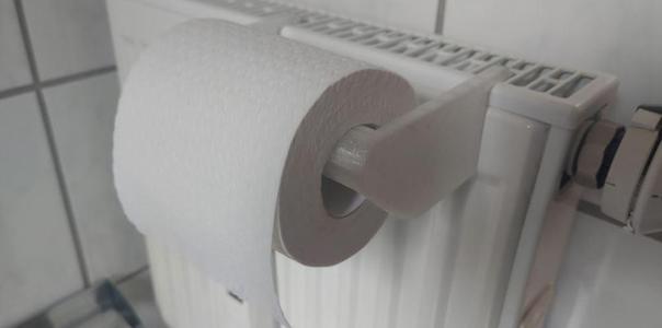 Toilet paper holder for radiator