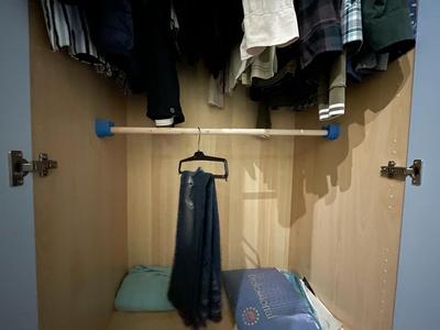 Wardrobe support for broom