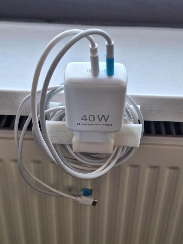 Cable and charger holder for the windowsill