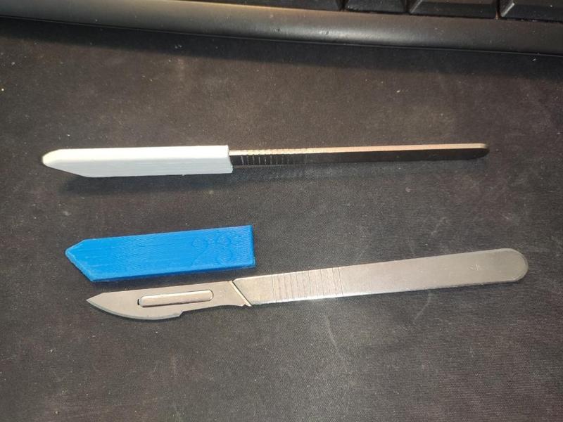 Scalpel protective cap.