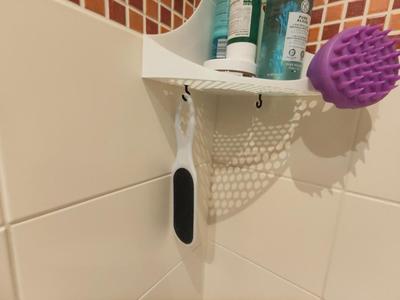 A simple hook for my rounded bathroom shelf