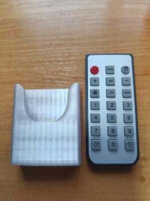 Holder for remote control for watch