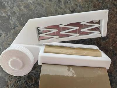 Tape cutter with blade   