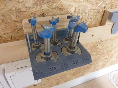 Forstner drill bit with depth limit holder for french cleat wall