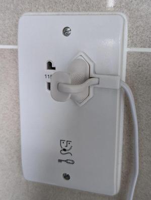 Shaver socket lead tidy for toothbrush etc