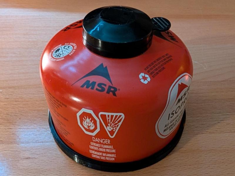 Camping stove fuel canister ring