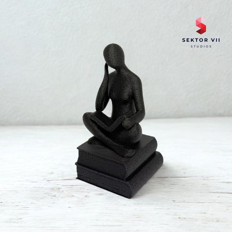 THINKING PERSON ON BOOKS SCULPTURE (WORLD BOOK DAY) 