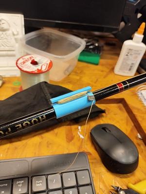 Fishing rod line holder